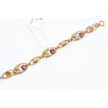 An amethyst glass and gold-filled bracelet,