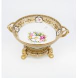 A Japanese Noritake porcelain fruit bowl on stand, the bowl centre decorated with flowers,