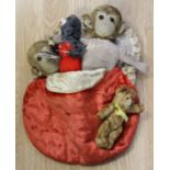 Three assorted plush toys including two monkeys and a teddy bear together with a Japanese tinplate