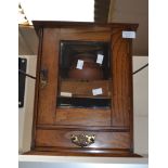 Early 20th Century smokers cabinet complete with tobacco jar and pipes in oak glazed case