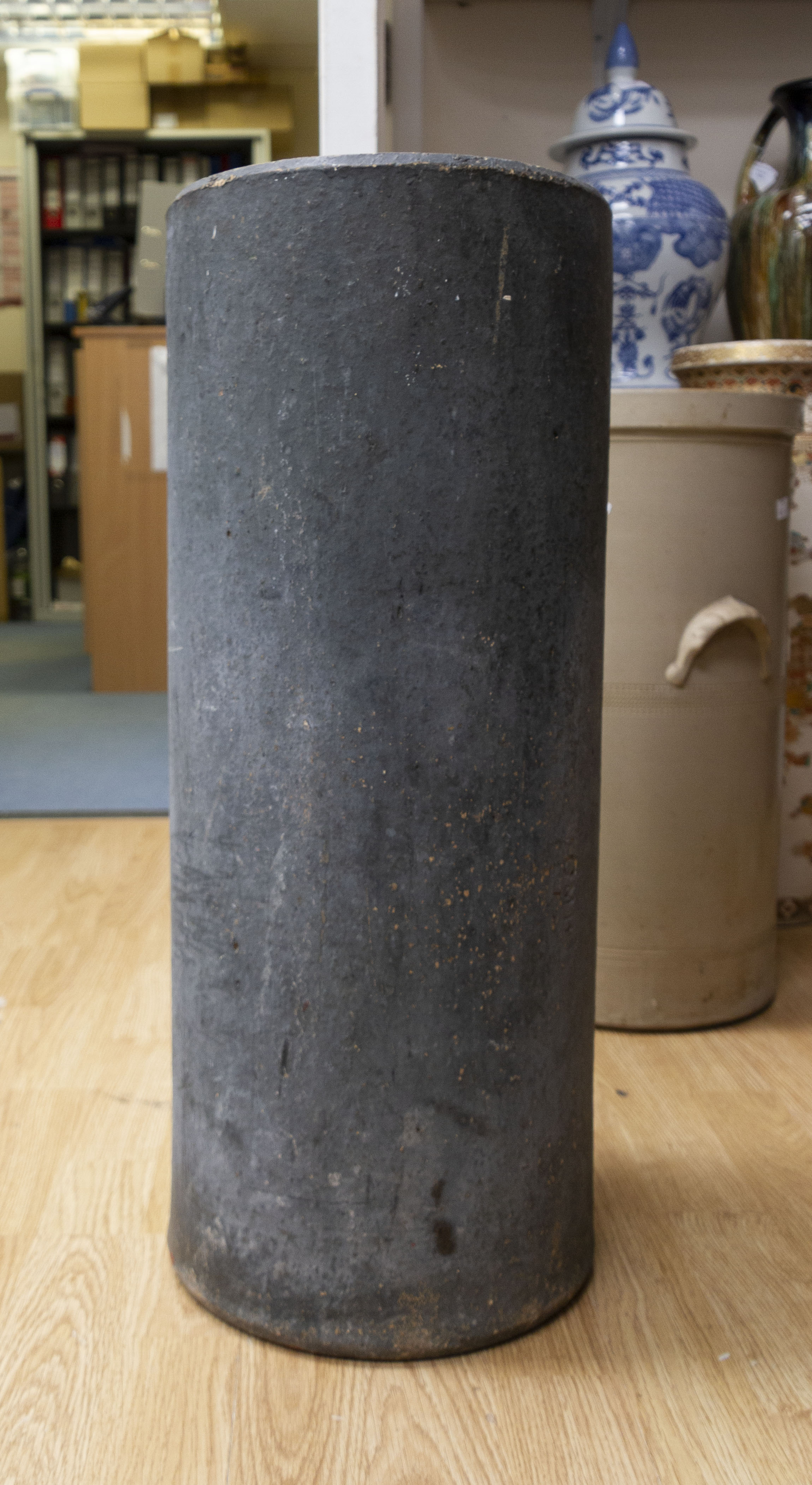 A large earthen ware umbrella stand,