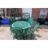 Green garden table and four chairs,