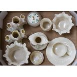 A quantity of Belleek porcelain, to include; posy vases, honey pot,