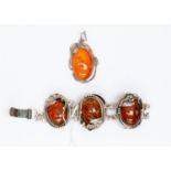 A silver and amber glass bracelet, with five panels, with a similar pendant, in a A J.