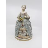 A Capodimonte figure of a lady, head re-glued,