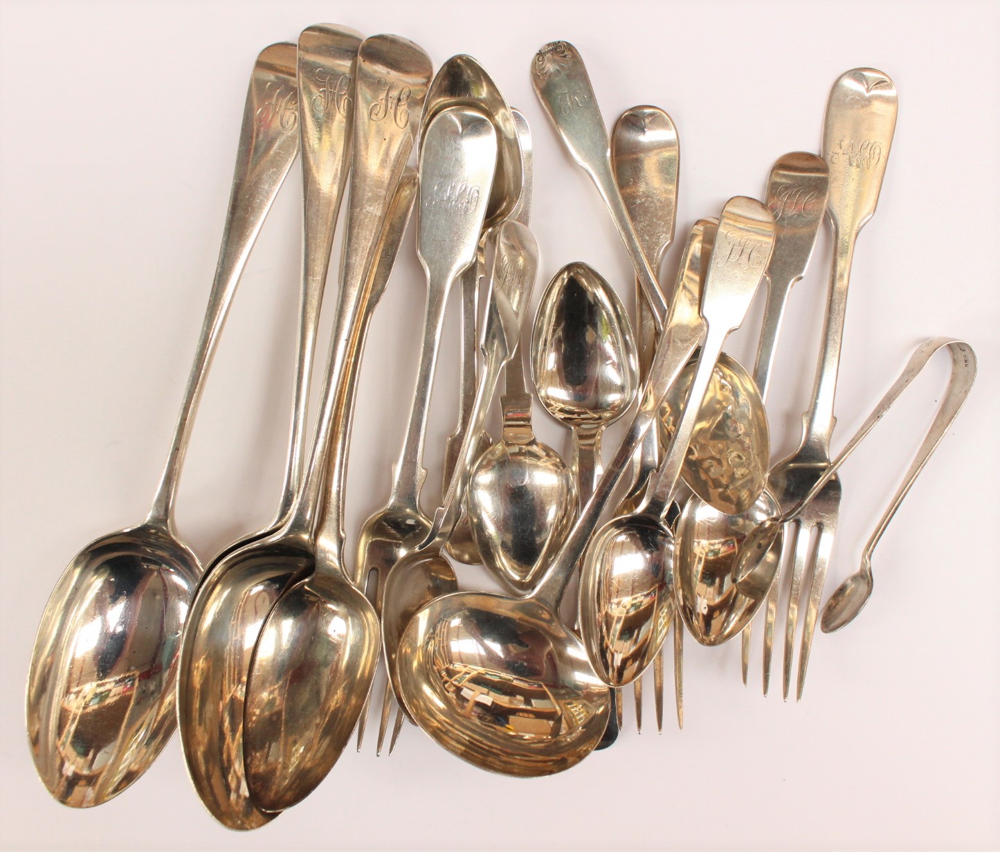 A collection of assorted cutlery mixed age and design