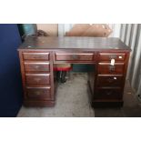 An Early 20th Century Oak Pedestal Desk on Castors.