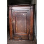 A George III Oak Corner Cupboard,