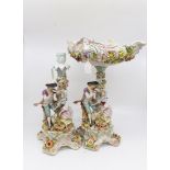 German porcelain comports with courting couple and a matching candle stick