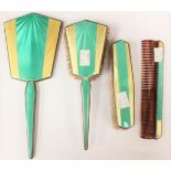 An Art Deco four piece silver and enamel brush set (s,