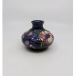 A vintage Moorcroft Anemone pattern onion shaped vase