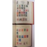 Two red stamp albums containing world stamps - spaces