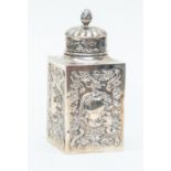 A late Victorian silver tea canister and cover, Rococo decoration, London 1891, 5.