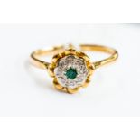 An 18ct gold emerald and diamond chip cluster ring, size O, gross weight approx 3.