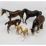 A collection of Beswick Horses to include: Bay Foal, large head down 4.