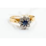An 18ct gold, sapphire and diamond cluster ring, with palladium settings, size N,