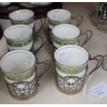 Six early 20th Century ceramic china cups with silver holders,