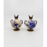 A pair of Royal Doulton small vases,