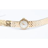A 9ct gold ladies Accurist watch, integral brick link bracelet strap, round dial,