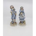 A pair of German Ernst Bohne Sohne figures in traditional dress;