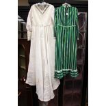 A 1974 wedding dress made in Canada, high waisted with a train, leg of mutton sleeves,