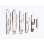 Five fruit knives mother of pearl with silver blades together with a miniature shagreen - ray skin