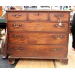 A George III mahogany chest of drawers, comprising three short over three long graduated drawers,