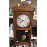 A 20th Century oak framed wall clock