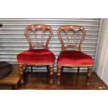 Two Victorian balloon back chairs with red upholstery