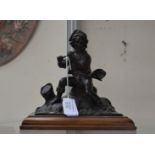 Bronze flautist on wooden base