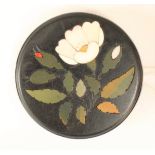 Ashford marble, a circular brooch, inlaid floral spray, white metal mount, approx 4.