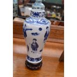 Chinese blue and white baluster shaped vase on wooden stand,