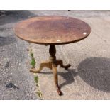 A George III oak tilt-top tripod table, circa 1820,