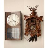 Four 20th Century wall clocks including a German cuckoo clock