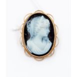 A black and white oval cameo,
