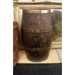 An antique oak brass hound barrel umbrella stand