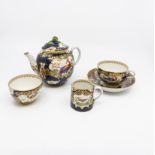 A Booth's blue and white with gilt tea set featuring exotic birds