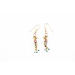 A pair of high carat gold and enamel earrings, inset with rose cut diamonds,