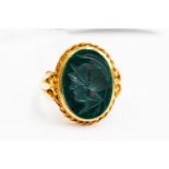 A blood stone intaglio ring, depicting Roman figure, 9ct gold, size N, total gross weight 5.4gms.