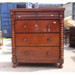 A George III mahogany hanging corner cabinet fitted with a single glazed door enclosing three