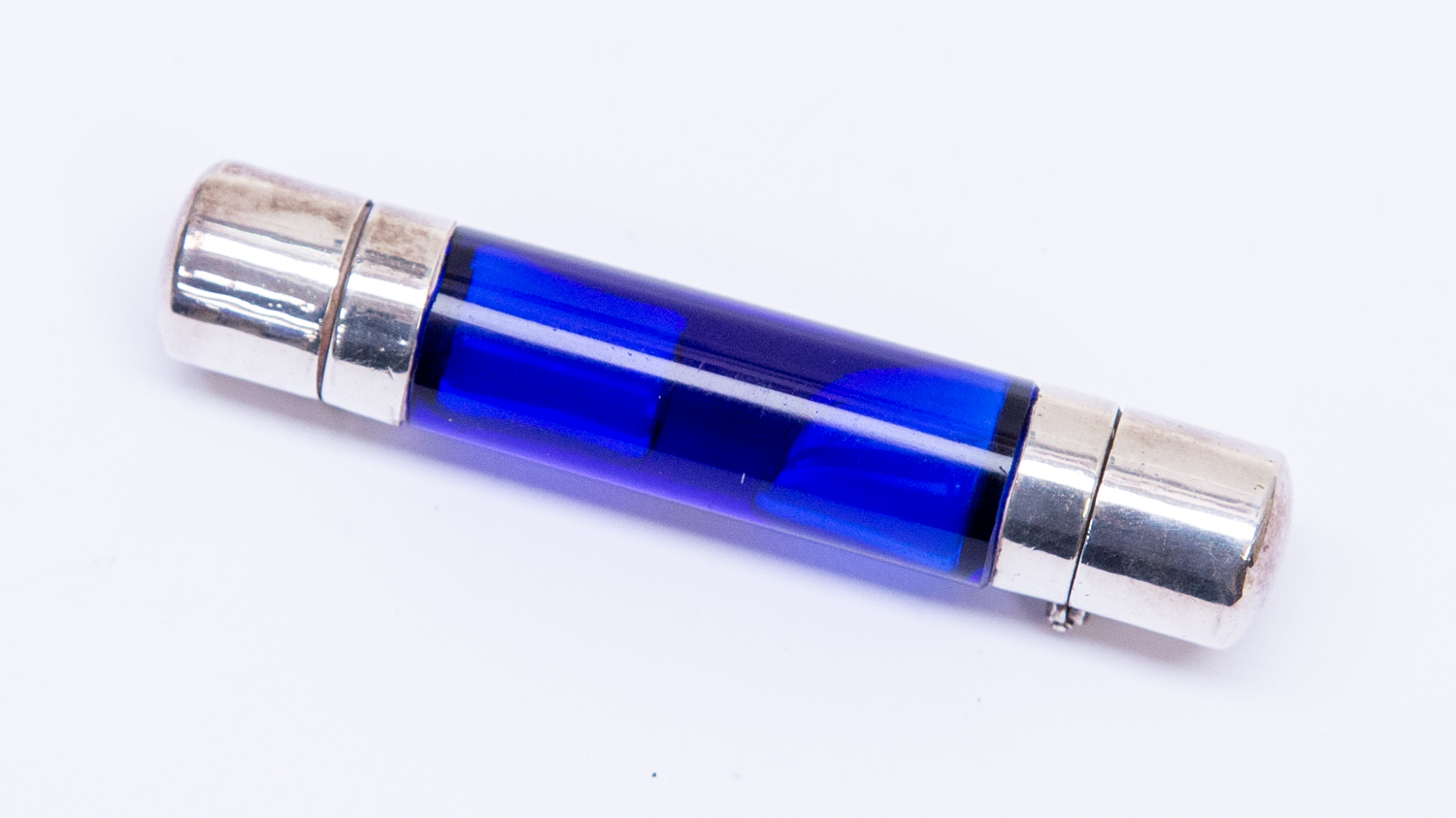 A 19th Century blue glass cylinder double ended scent bottle,