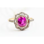 A synthetic ruby and diamond dress ring, with openwork flower design set with grain set diamonds,