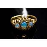 An 18ct gold opal three-stone ring, diamonds points,