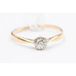 An 18ct solitaire diamond ring, claw set cushion cut diamond of approx 0.