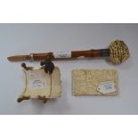 A carved ivory cane handle,