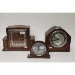 A Smith Art Deco stained wood framed mantle clock,