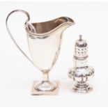 A helmet shaped silver cream jug, Chester 1899 together with a silver pepperette,