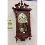 An 20th Century Mahogany Maxim 31-day wall clock.