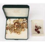 A Victorian garnet unmarked metal brooch along with a pair of cabochon drop earrings,