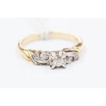 An 18ct gold and diamond solitaire ring, white gold settings, size N, approx 3.